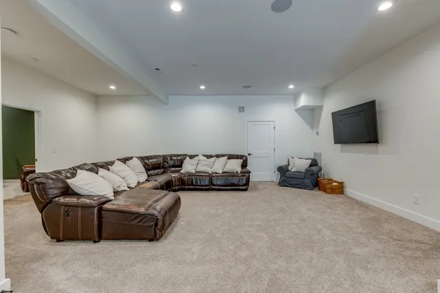 a view of a house with backyard and trees
