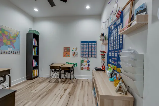 a view of a swimming pool with a yard and seating area