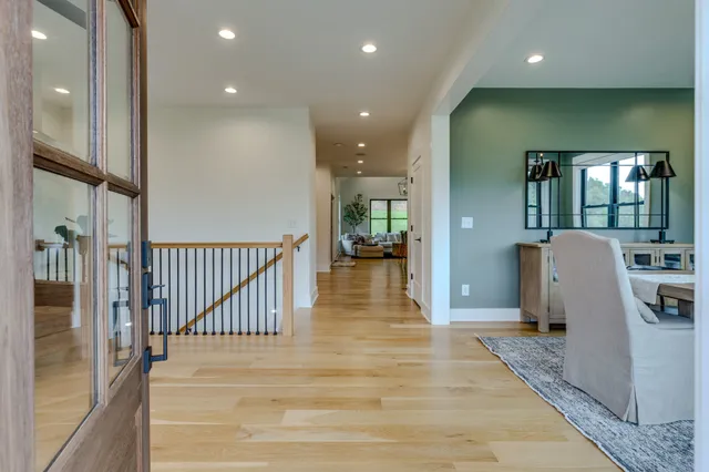 a view of a livingroom with furniture window and wooden floor