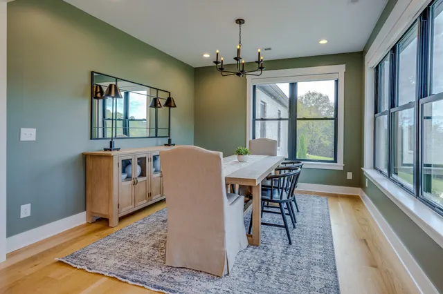 a view of a kitchen with a table and chairs