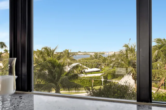a living room with furniture gym equipment and a window
