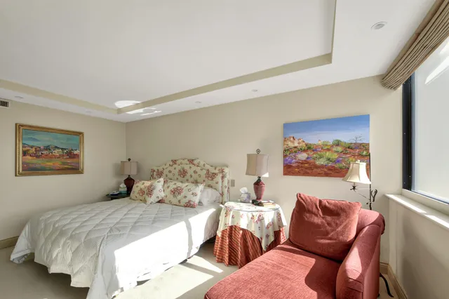 a bathroom with a granite countertop sink mirror and a bathtub