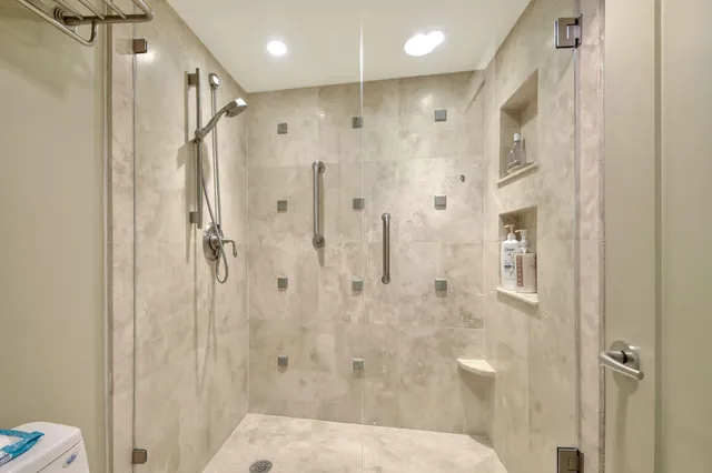 a dining room with furniture and a rug