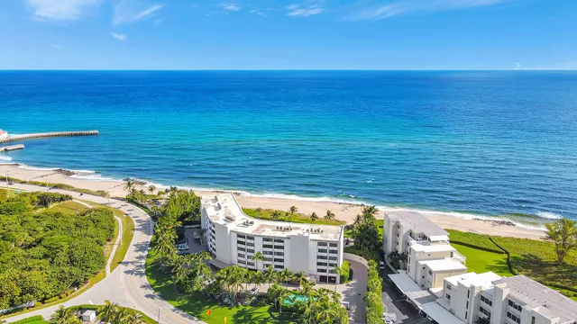 a view of a balcony with floor to ceiling windows