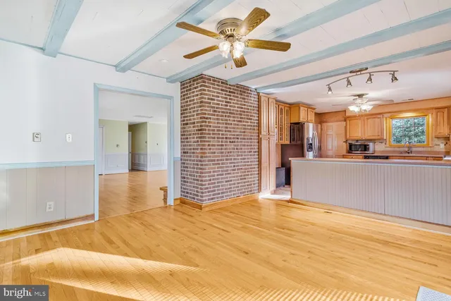 a view of a livingroom with a kitchen