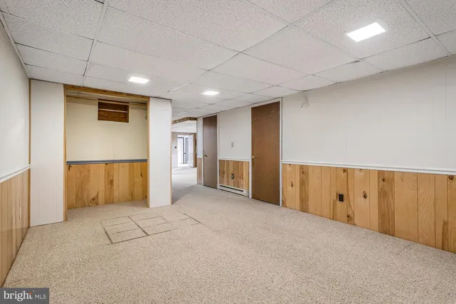 a view of an empty room with a cabinet