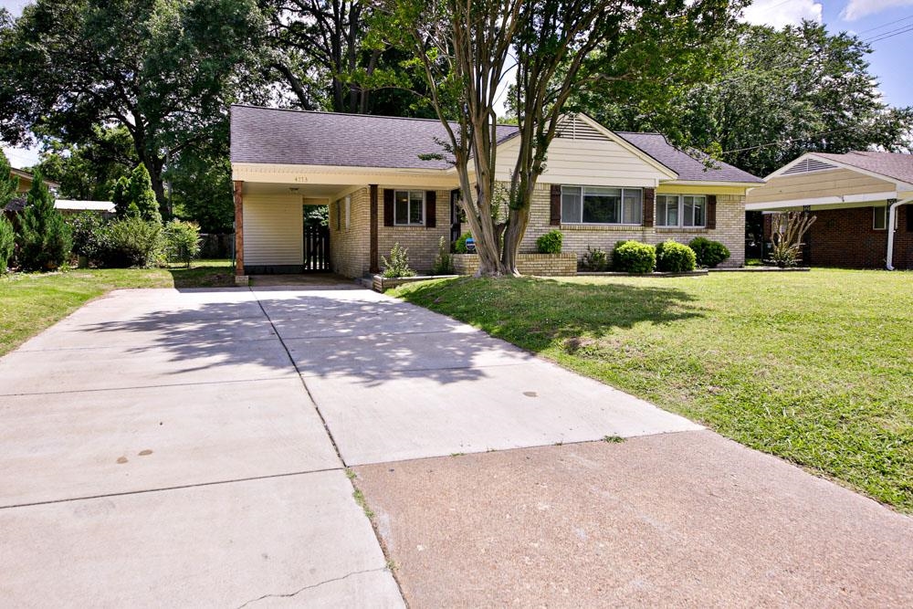 4773 Quince Road Memphis, TN 38117 - Photo 2 of 11 a front view of a house with a yard