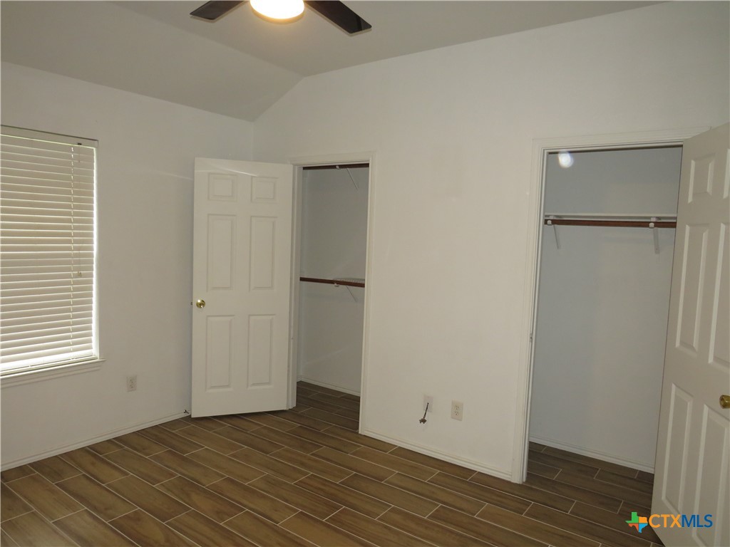 4608 Bowles Drive, Unit D Killeen, TX 76549 - Photo 7 of 15 an empty room with wooden floor closet and windows