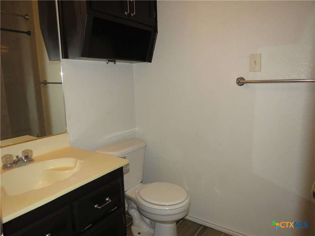 4608 Bowles Drive, Unit D Killeen, TX 76549 - Photo 9 of 15 a bathroom with a sink and a toilet