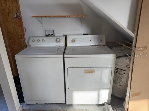a utility room with dryer and washer