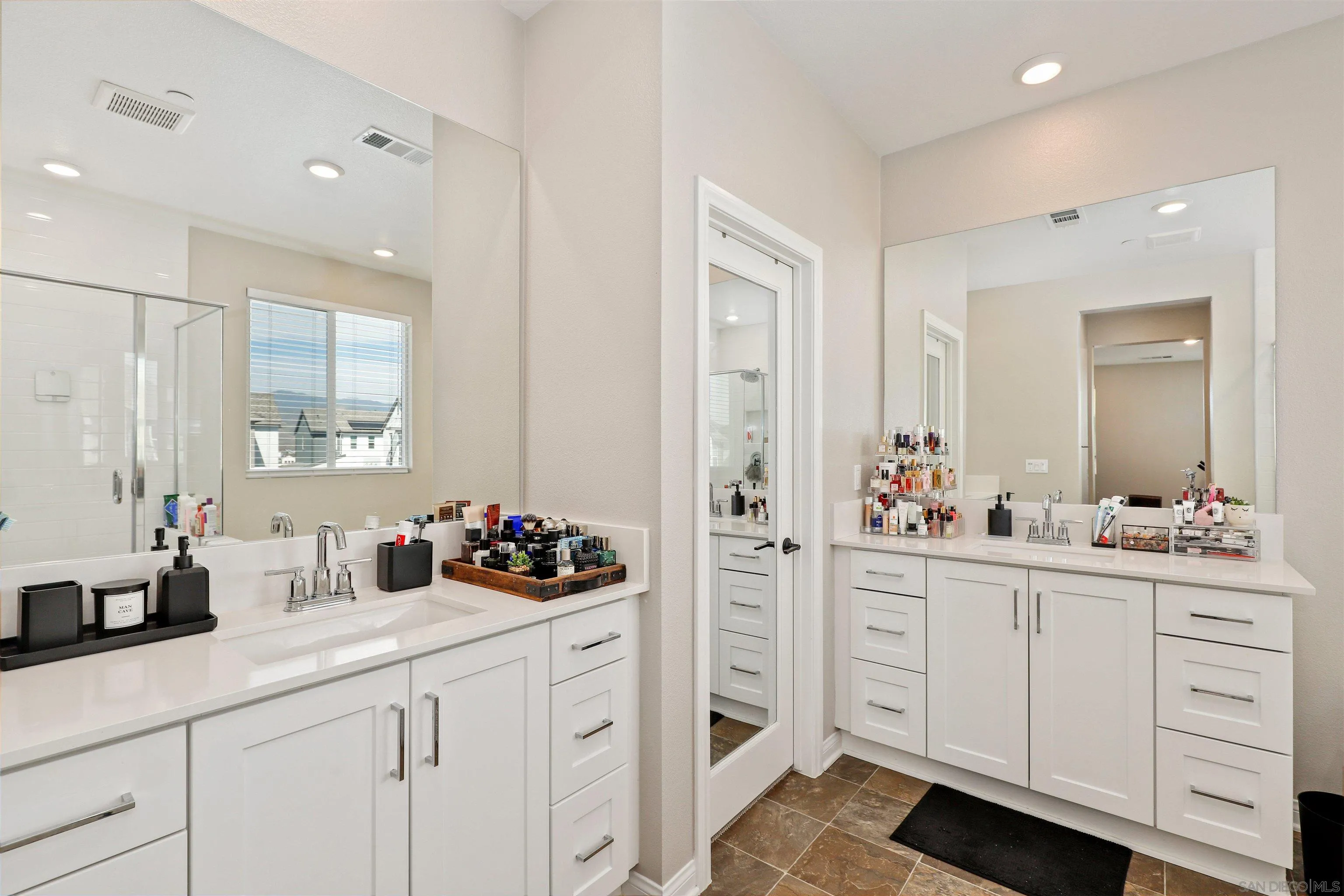 1799 Whitmore Loop Chula Vista, CA 91913 - Photo 22 of 36 a kitchen with white cabinets and sink