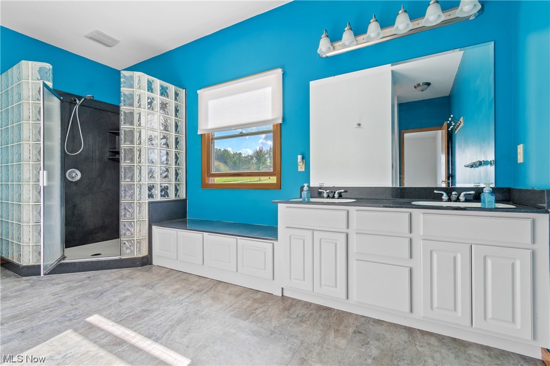 5670 South Funk Road Shreve, OH 44676 - Photo 22 of 35 Ensuite bathroom featuring dual vanity