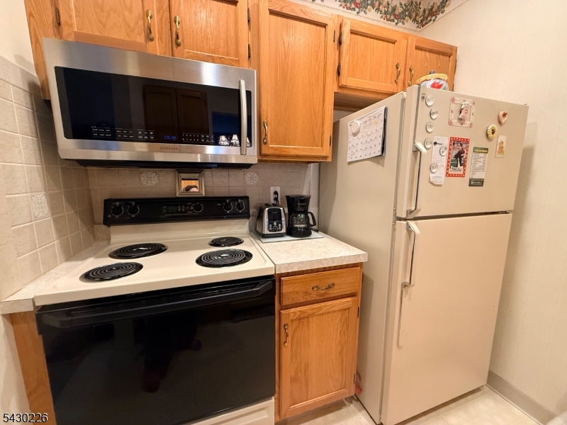 1302 Richmond Road, Unit 302 West Milford, NJ 07480 - Photo 3 of 21 a utility room with dryer and washer