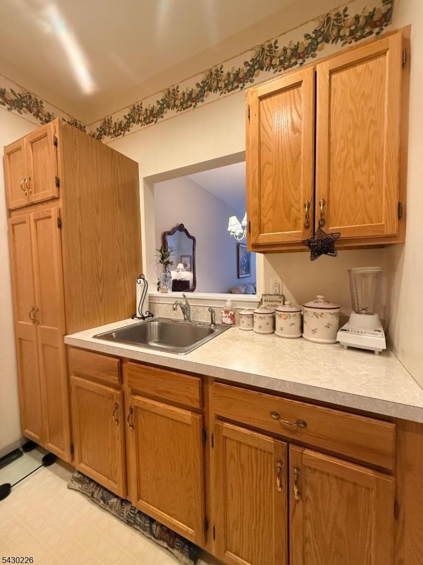 1302 Richmond Road, Unit 302 West Milford, NJ 07480 - Photo 7 of 21 a bathroom with a granite countertop sink and a mirror