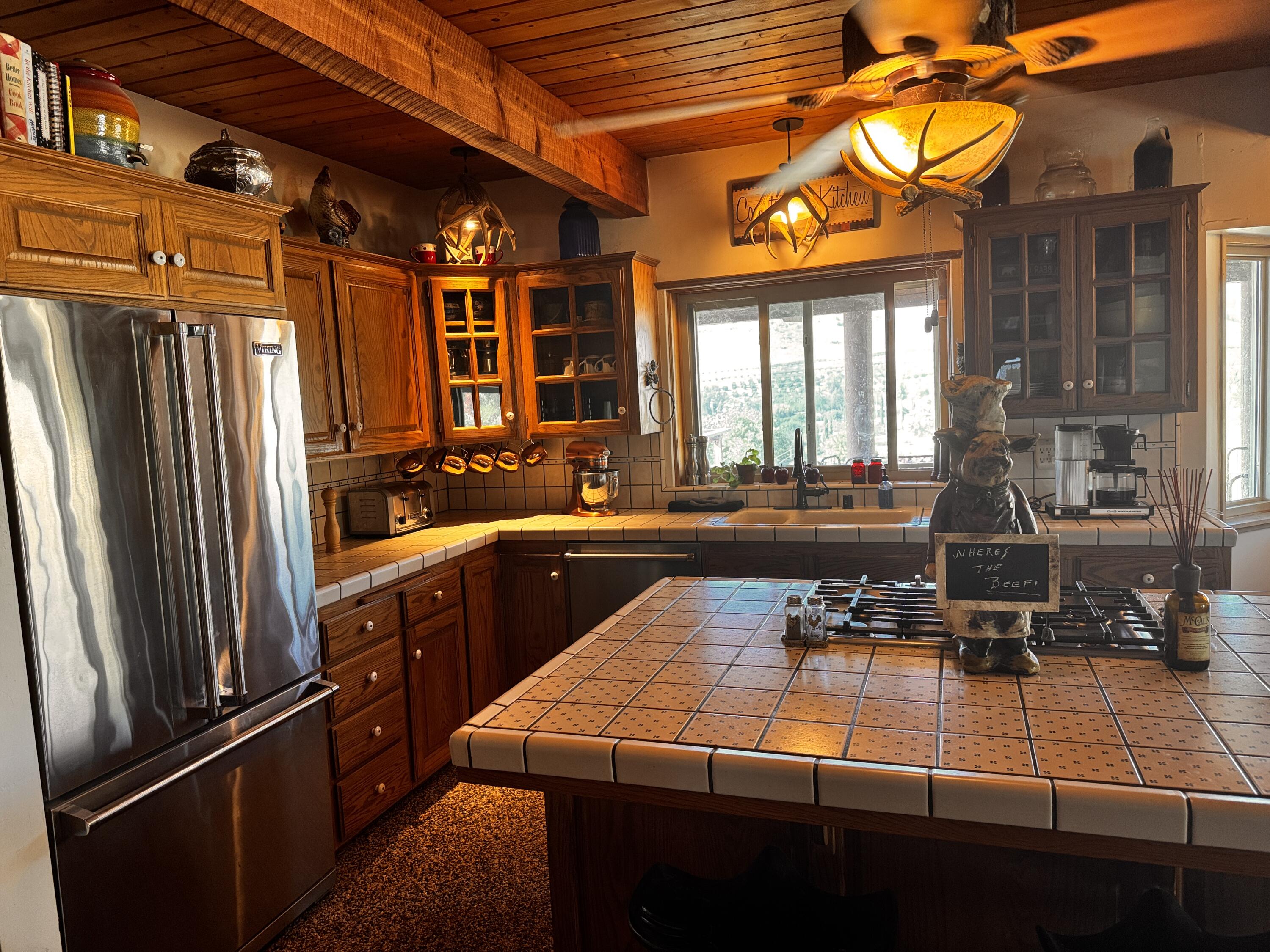 30723 Hamilton Drive Exeter, CA 93221 - Photo 47 of 85 a kitchen with stainless steel appliances granite countertop a refrigerator and a sink