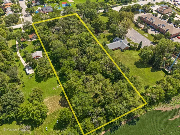 an aerial view of residential house with an outdoor space
