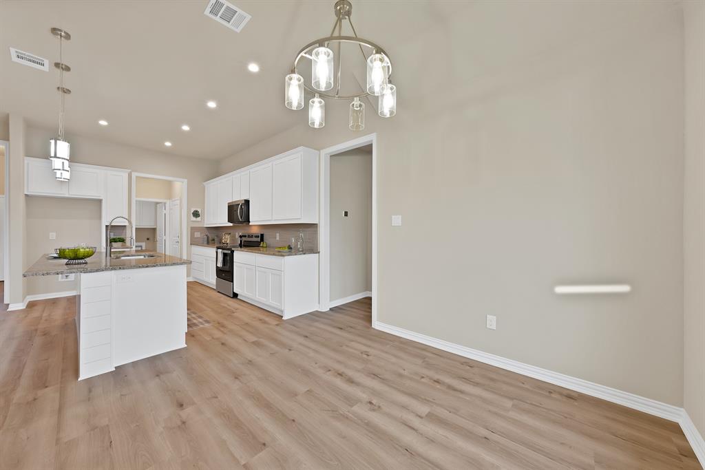 106 Panther Loop Mabank, TX 75147 - Photo 11 of 34 a view of kitchen with granite countertop cabinets and refrigerator