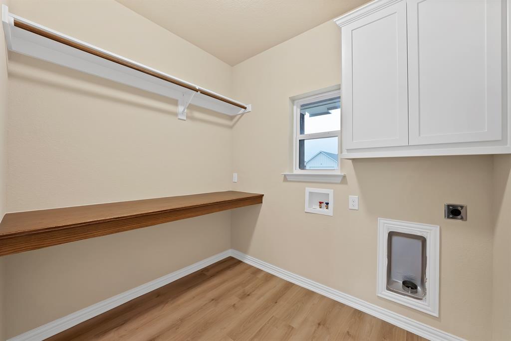 106 Panther Loop Mabank, TX 75147 - Photo 18 of 34 a view of storage and utility room with wooden floor