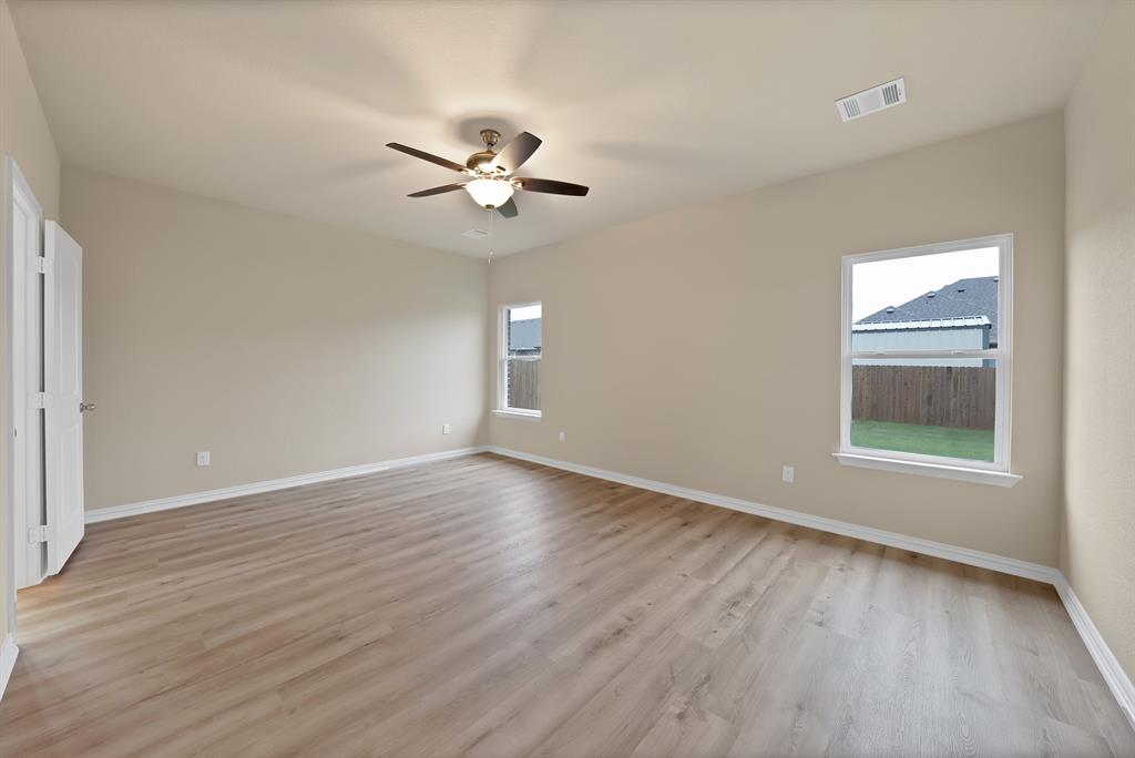 106 Panther Loop Mabank, TX 75147 - Photo 26 of 34 a view of empty room with wooden floor and fan