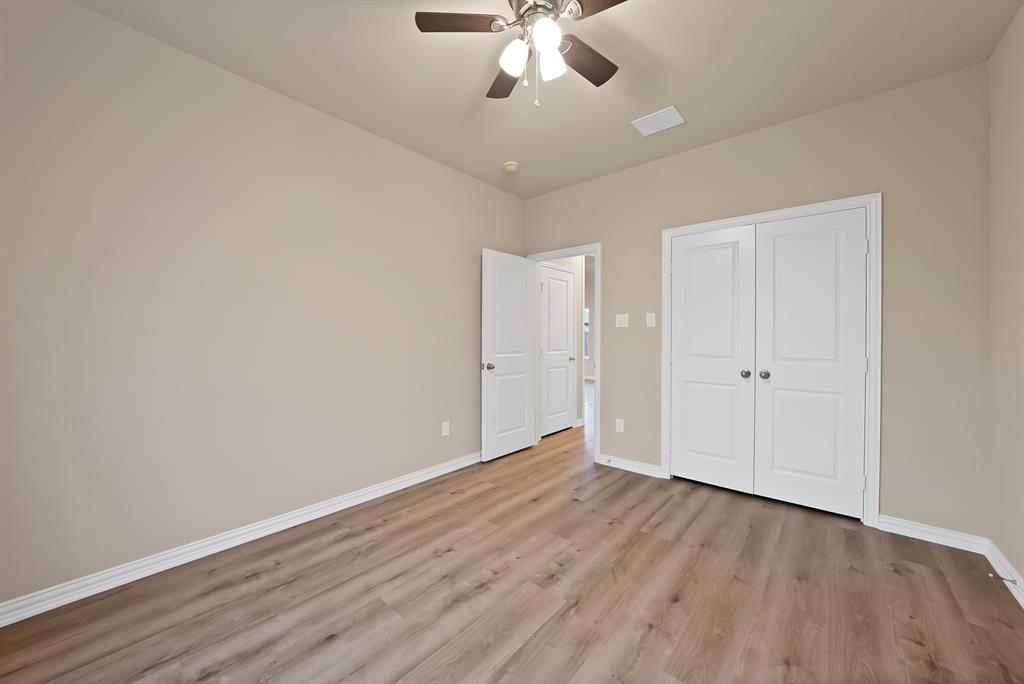 106 Panther Loop Mabank, TX 75147 - Photo 30 of 34 a view of an empty room and wooden floor
