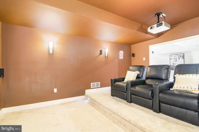 a living room with furniture and a lamp