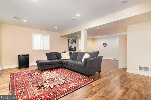 a living room with furniture and a rug