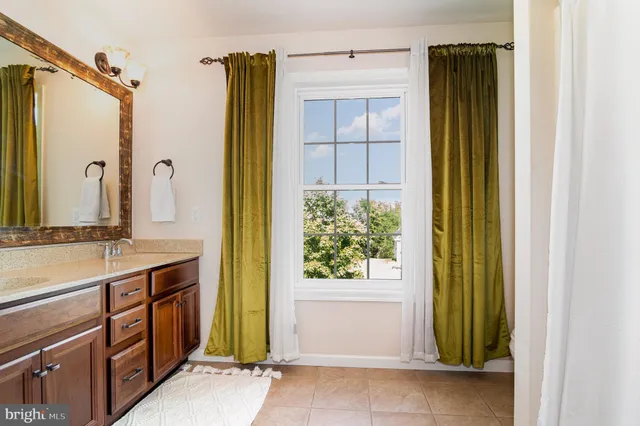 a white toilet sitting next to a shower curtain