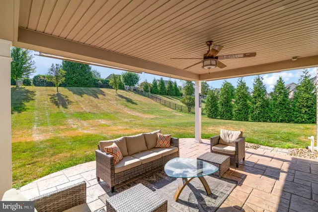 a view of a patio with couches chairs dining table and chairs