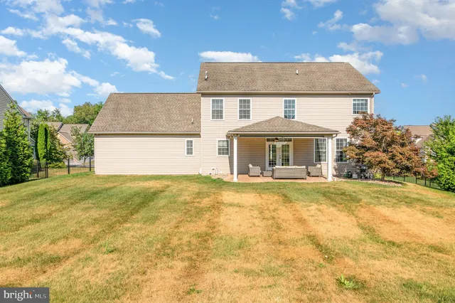 a front view of house with outdoor space and garden