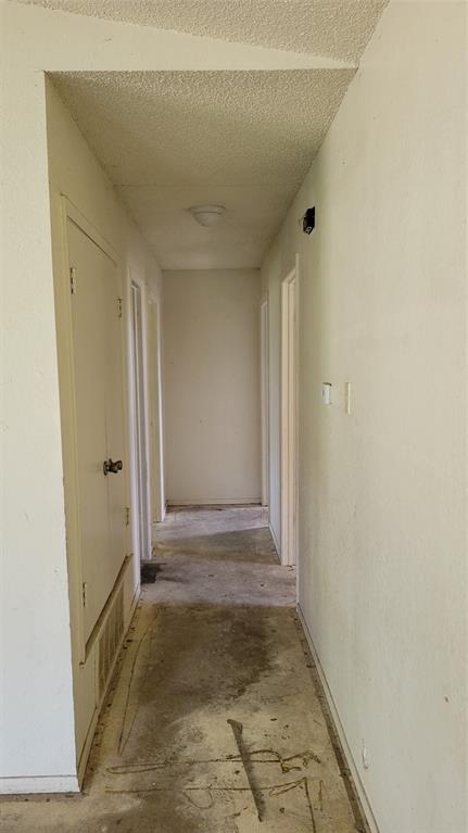 902 South Old Temple Road Hewitt, TX 76643 - Photo 6 of 32 Hallway with overhead light fixture and multiple doorways
