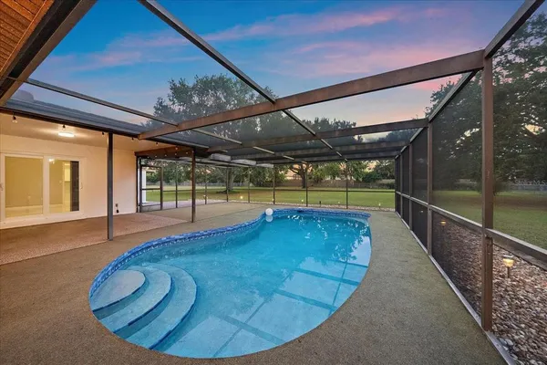 a view of a swimming pool with a porch