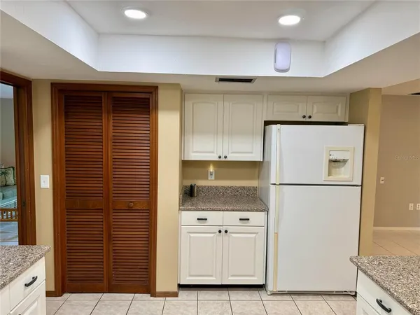 a kitchen with appliances and cabinets