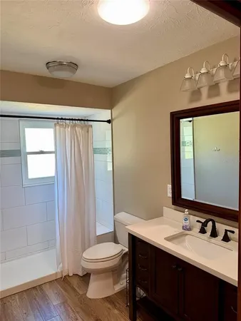 a view of an empty room with glass door