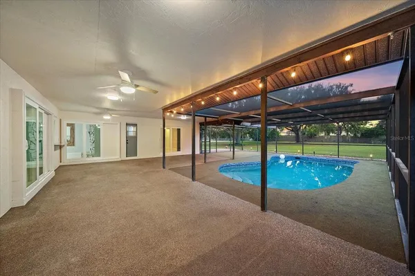 a view of a swimming pool with a porch