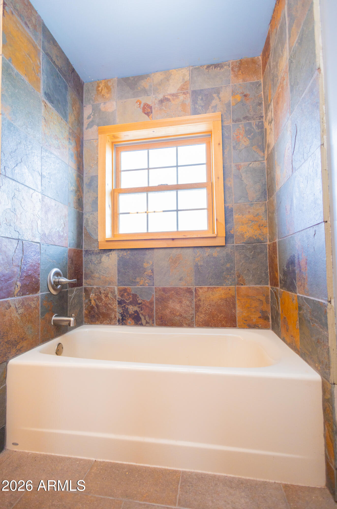 3429 West Markel Road Douglas, AZ 85607 - Photo 30 of 47 a white bath tub sitting next to a window