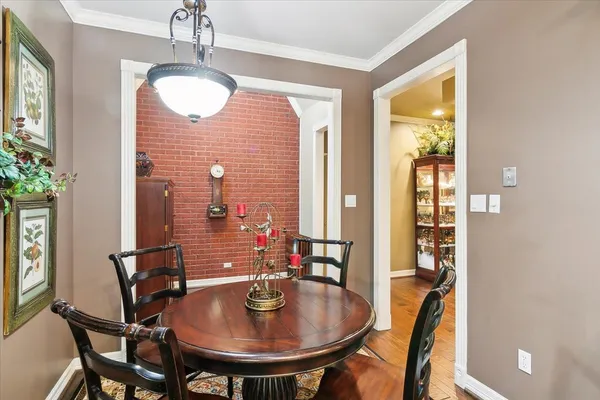 a view of a dining room with furniture and window