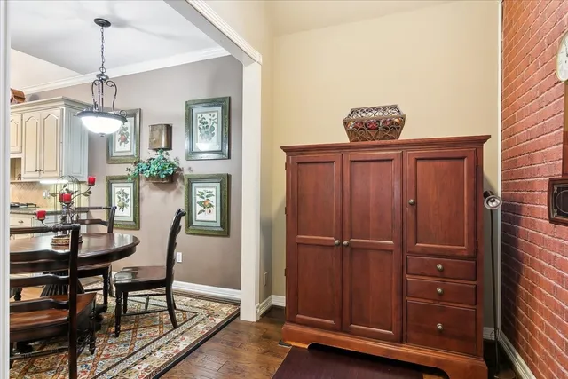 a view of a dining room with furniture and chandelier