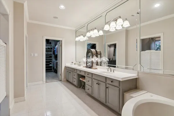 a spacious bathroom with a double vanity sink double and a mirror