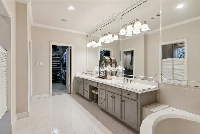 a spacious bathroom with a double vanity sink double and a mirror