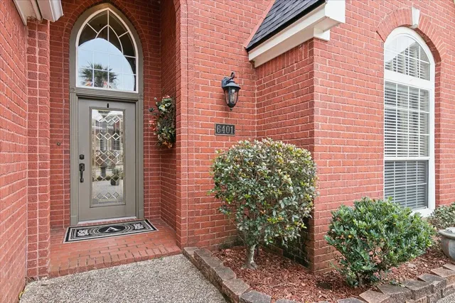 a front view of a house with a glass windows