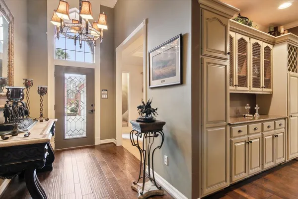 a view of a entryway with furniture and wooden floor
