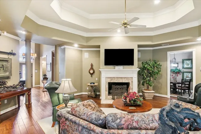 a living room with furniture fireplace and flat screen tv