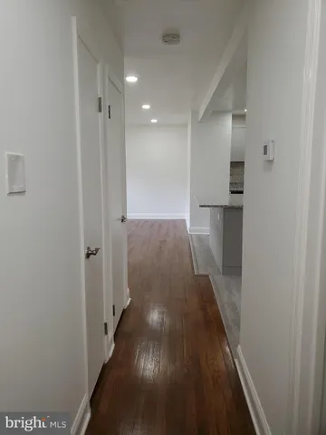 a white toilet sitting next to a white sink