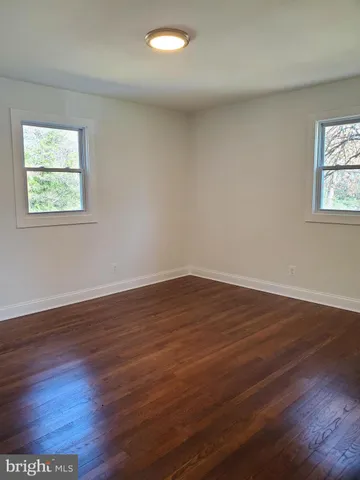 a white toilet sitting next to a shower