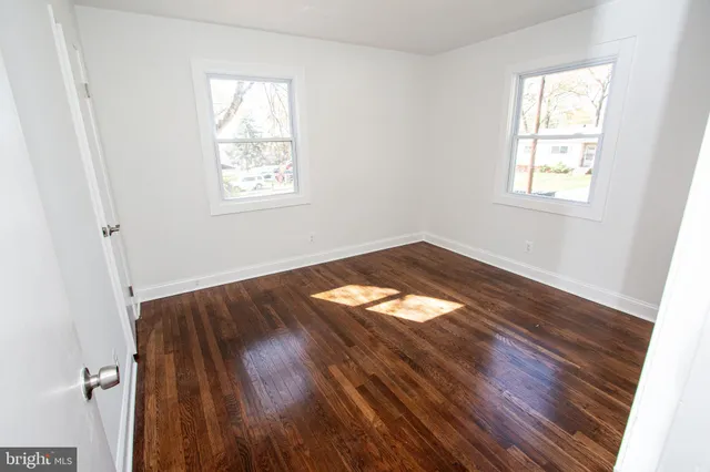 an empty room with windows