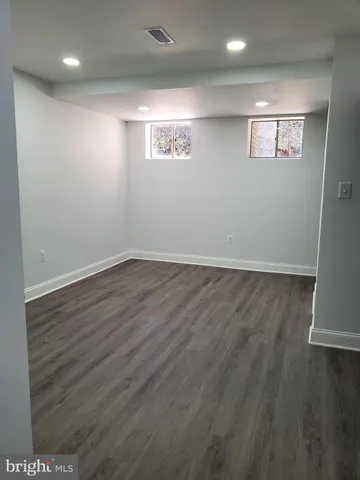 a bathroom with a sink toilet and mirror