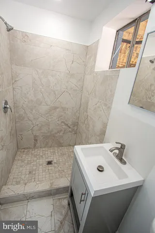 a kitchen with a sink and a stove top oven