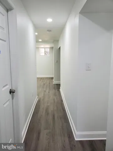 a kitchen with a refrigerator and a sink