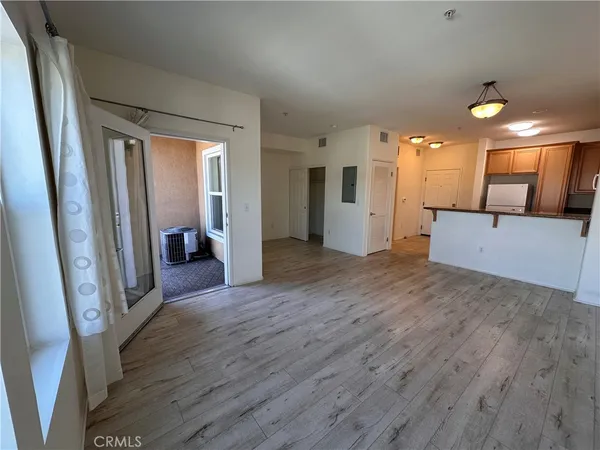 a view of a hallway view with wooden floor and staircase