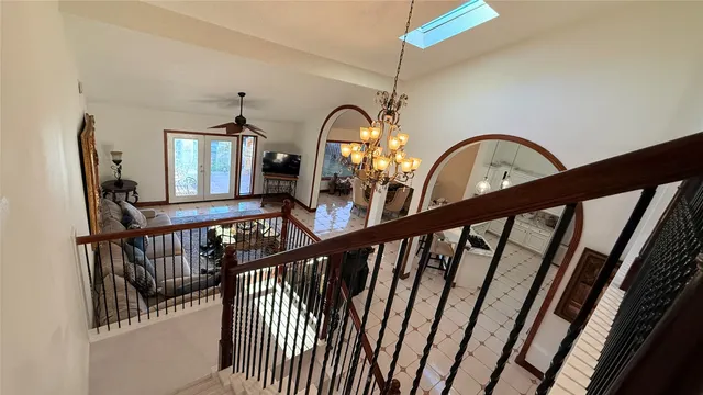 a view of staircase with wooden floor
